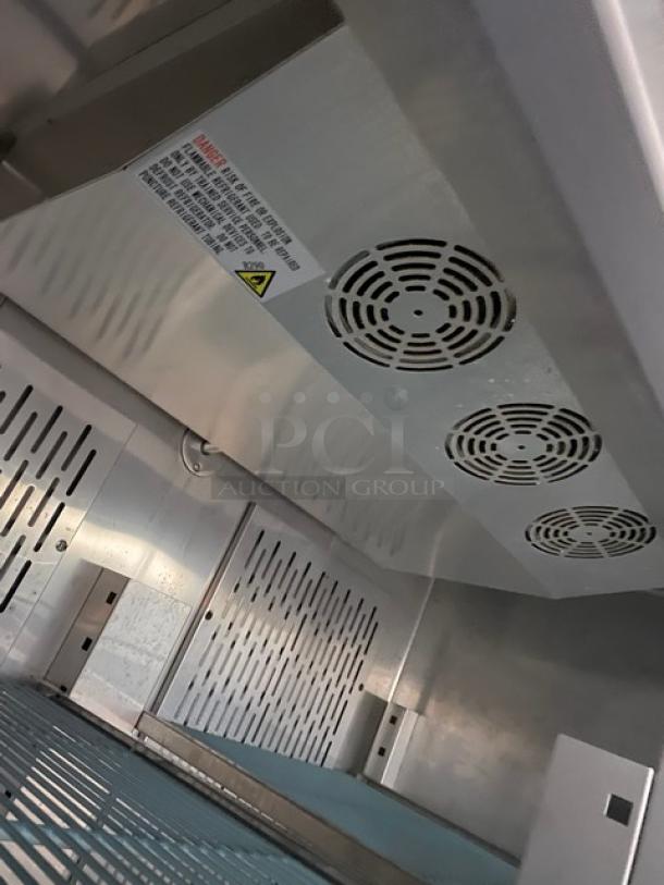 Avantco commercial refrigerator interior with poly coated wire racks, model 178SS2RGHC. Durable stainless steel.
