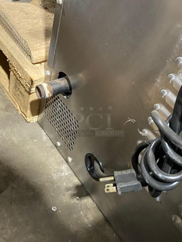Vulcan commercial stainless steel convection oven, natural gas powered, with thermostatic control and wired racks.