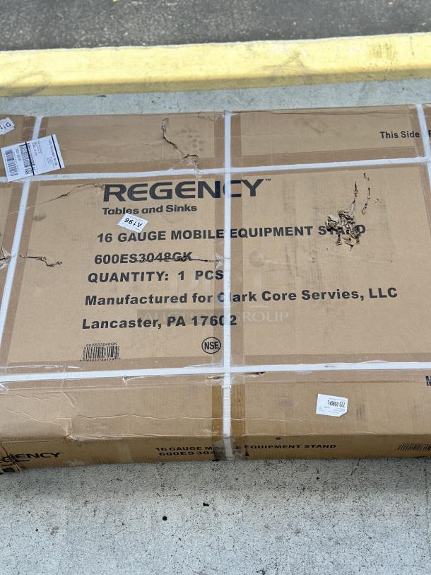 Regency 30" x 48" stainless steel equipment stand, model 600ES3048GK, new with visible box damage. Includes casters.