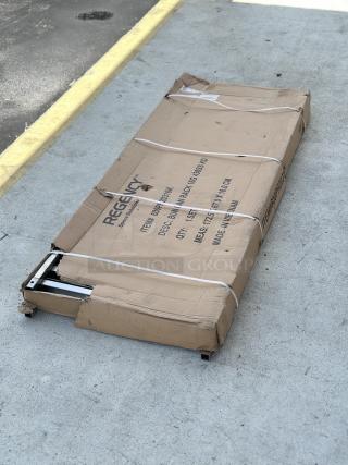 Brand new Regency 20 Pan End Load Stainless Steel Bun/Sheet Pan Rack, Model 600pr20316k, unassembled in original scratched box.
