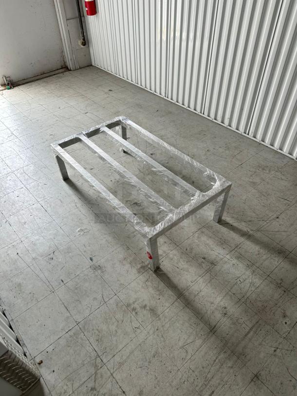 Advance Tabco aluminum dunnage rack, 60"x20"x8", 2,000 lb. capacity, model 109DUN20608, brand new, in industrial setting.
