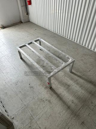 Advance Tabco aluminum dunnage rack, 60"x20"x8", 2,000 lb. capacity, model 109DUN20608, brand new, in industrial setting.