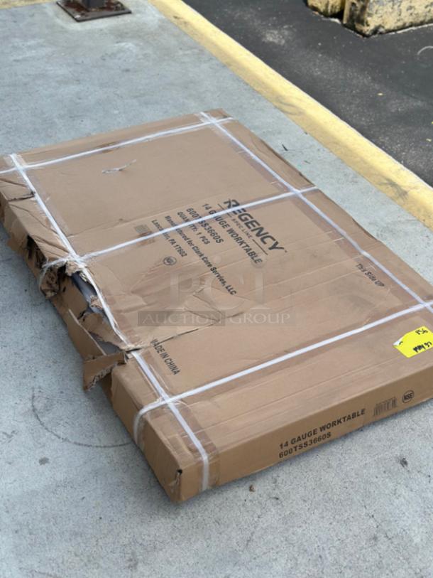 Regency 36" x 60" stainless steel work table, model 600TSS3660S, new condition, packaging dented.