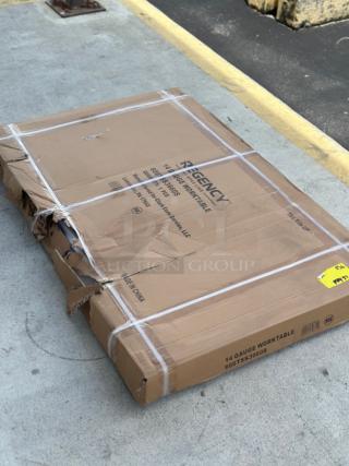 Regency 36" x 60" stainless steel work table, model 600TSS3660S, new condition, packaging dented.