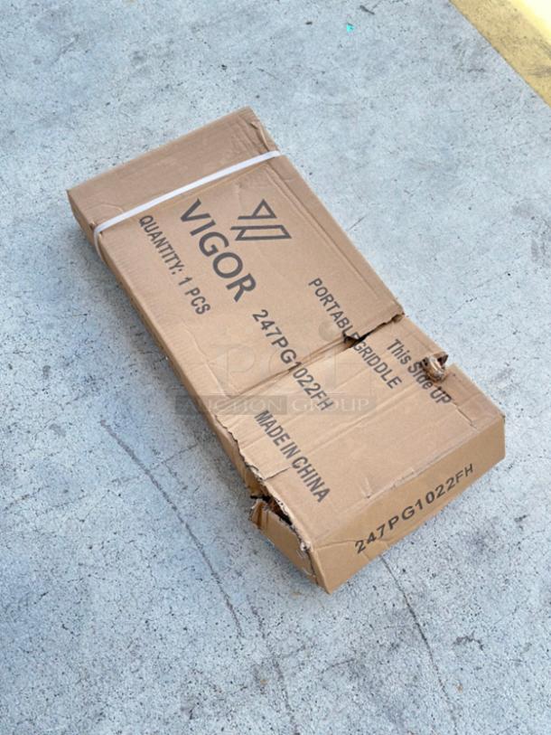 Vigor 11" x 23" portable steel griddle, model 247PG1022FH, in original packaging with visible box damage.