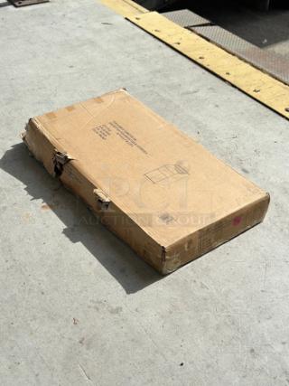 Brand new Lancaster Table & Seating 46" Walnut Host Station, model 164WAITRS1WL, in worn packaging showing damage.