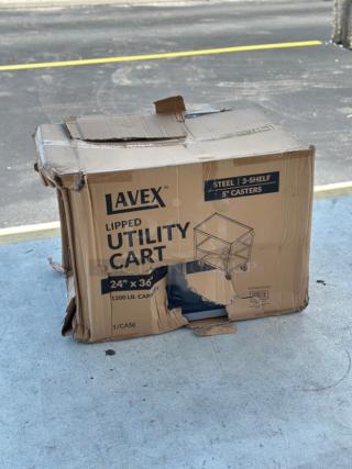 Lavex 36" x 24" x 35" steel utility cart, three trays, in damaged box showing wear. New with scratches and dents.