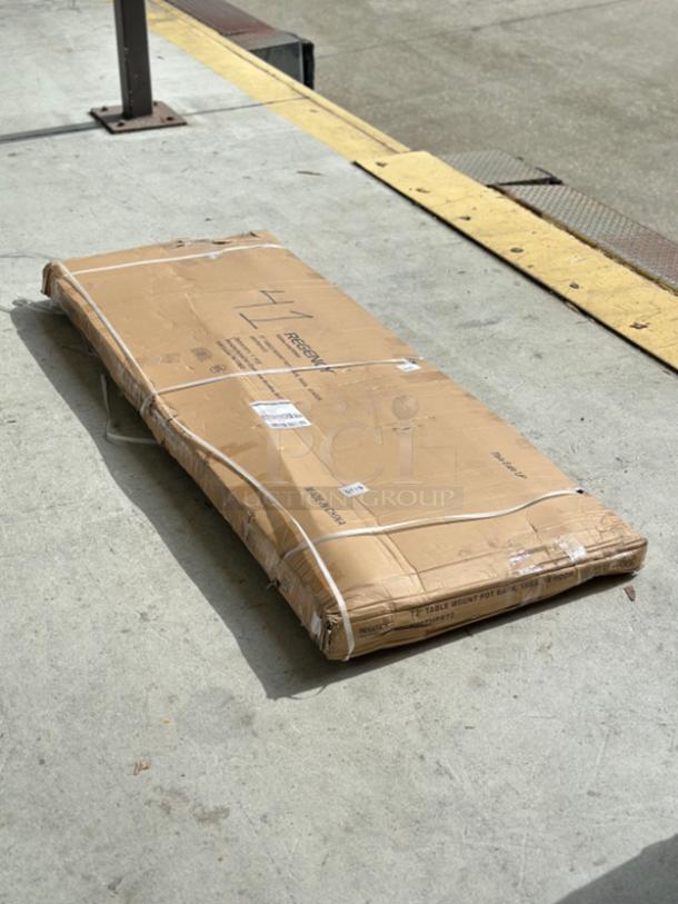 Brand new Regency 72" stainless steel pot rack (model 600TMPR72) in original packaging, minor box damage.