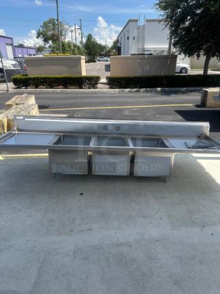 BRAND NEW Regency 104" three compartment stainless steel sink with cross bracing and two drainboards. Scratch and dent condition.