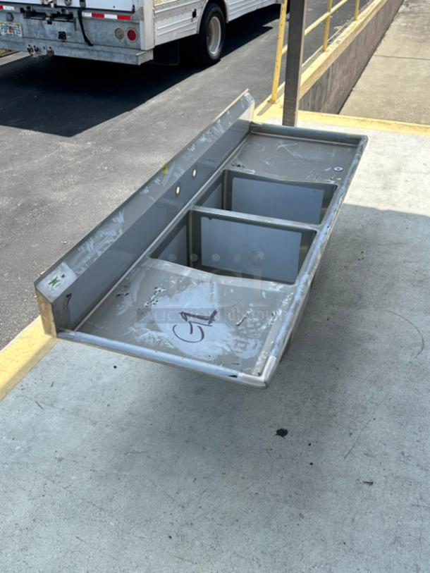 Regency 86" 16-gauge stainless steel two-compartment sink with drainboards. Scratch and dent. 24"x24"x14" bowls. G1 marking.