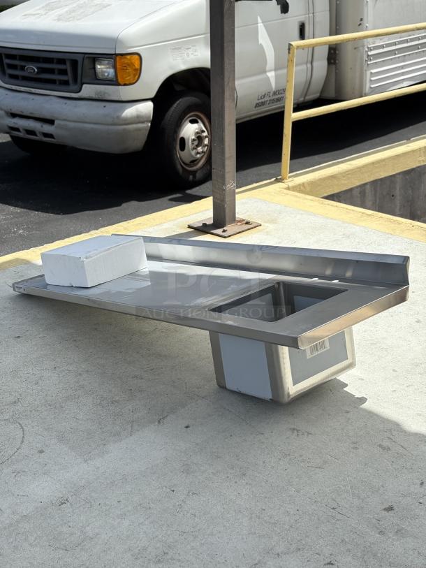 Brand new Regency 600ST2472R one compartment sink with left drainboard, scratch and dent condition, steel finish.