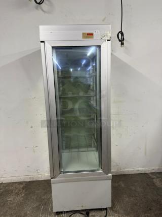 TEKNA 4400NFN 4-sided glass refrigerated display case, pristine condition, clear shelves, visible labels on top.