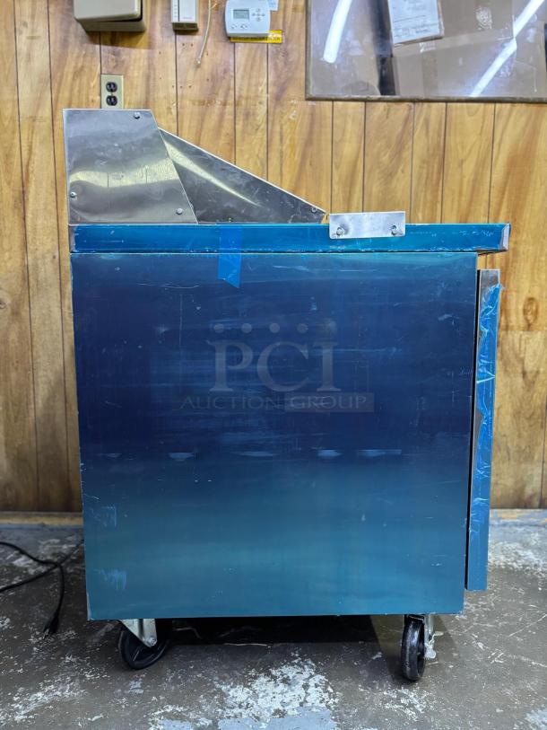 DUKERS DSP29 1-Door Commercial Food Prep Table Refrigerator, stainless steel, mega top, on casters, good condition.
