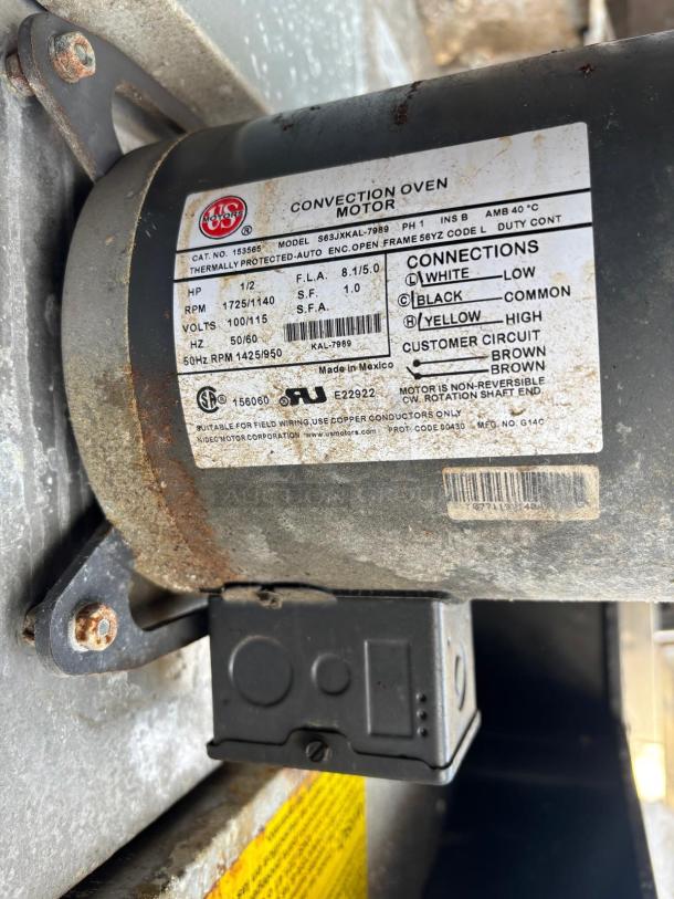 Label on Duke E101-G convection oven motor, model S63JXKAL-7989, shows specs: 1/2 HP, 1725/1140 RPM, thermally protected.
