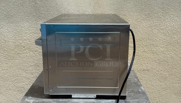Panasonic NE-2180 Sonic Steamer Microwave Oven, stainless steel, commercial grade, side view showing condition.