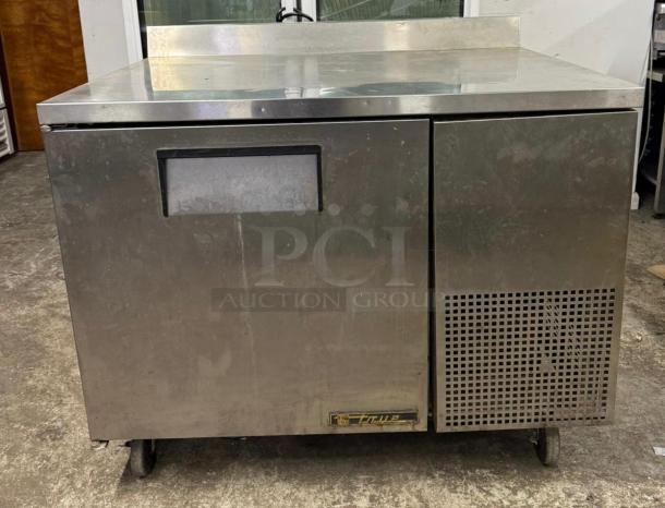 TRUE TWT-44-HC worktop refrigerator with backsplash, stainless steel, used condition, 44 1/2" deep, visible model tag.