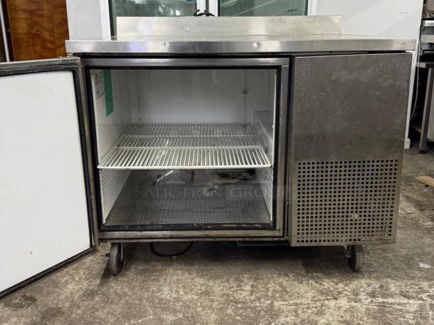 TRUE TWT-44-HC worktop refrigerator, stainless steel, open door, one shelf, 44 1/2" deep, visible wear.