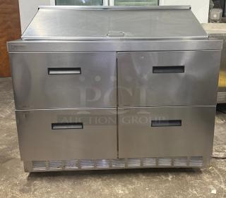 DELFIELD D4448NP-18M 48" refrigerated sandwich prep table with 4 drawers and 5" casters, stainless steel, excellent condition.