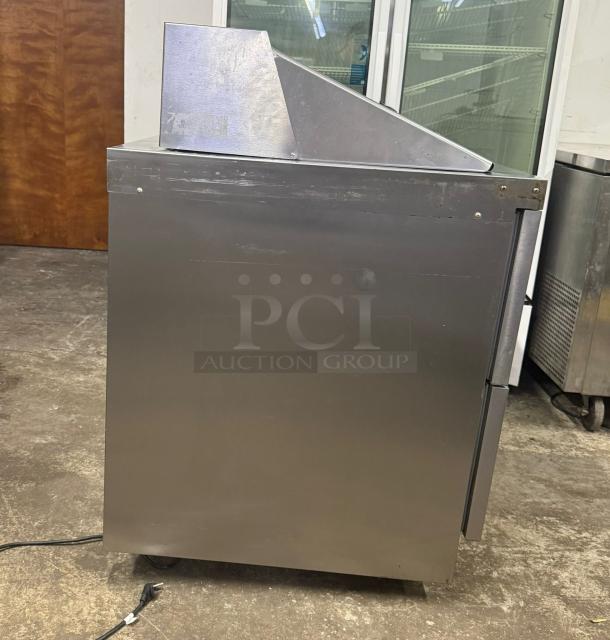 Delfield D4448NP-18M 48" 4-drawer refrigerated prep table, stainless steel, with 5" casters. Used condition.