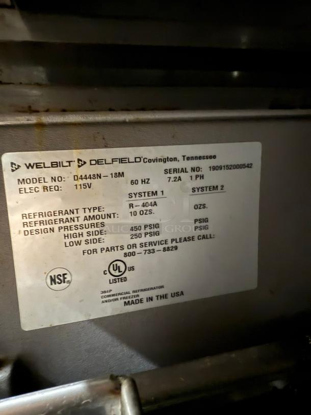 Delfield D4448NP-18M 48" Refrigerated Sandwich Prep Table, 4 drawers, 5" casters, model label with specs shown, NSF certified.