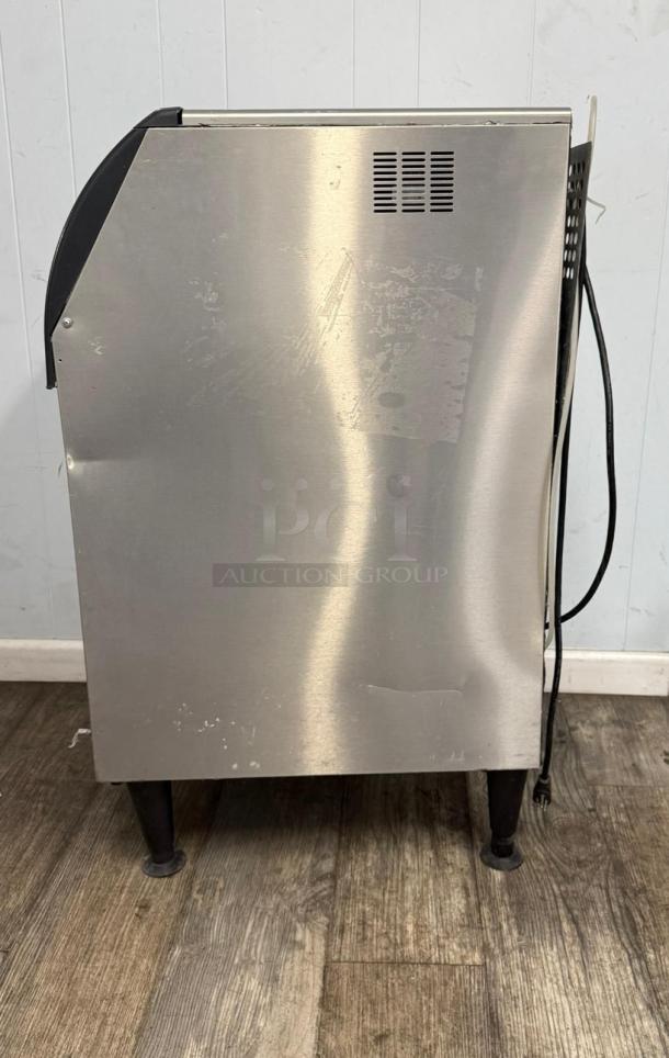 Scotsman CU0920MA-1A undercounter ice machine, stainless steel, some surface wear, visible cords, model label not shown.