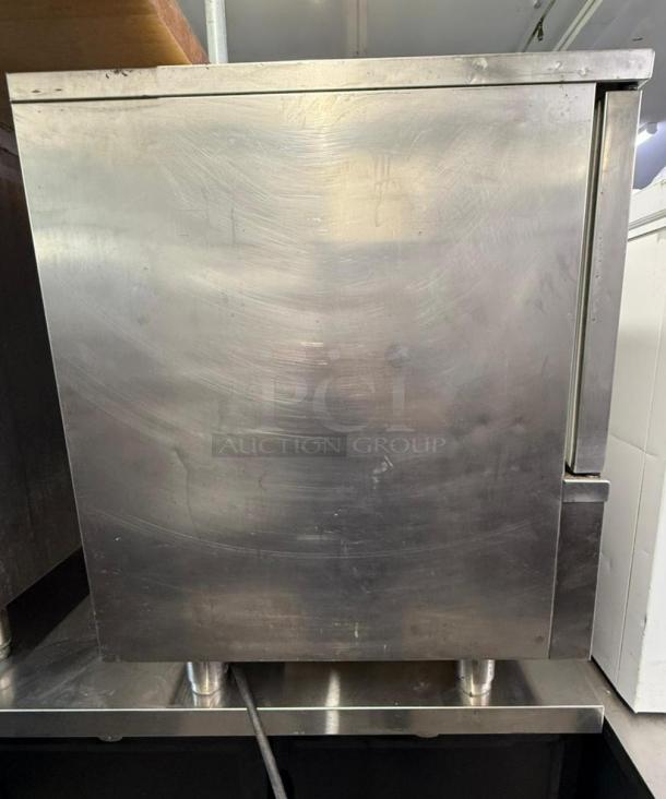 IRINOX M51-20 blast chiller in good condition, stainless steel exterior, standing on metal legs, suitable for commercial use.