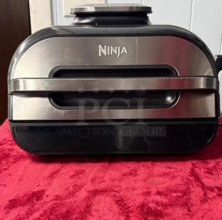 Ninja FG551 Foodi Smart XL Grill, 6-in-1 indoor model, stainless steel, excellent condition, brand logo visible.