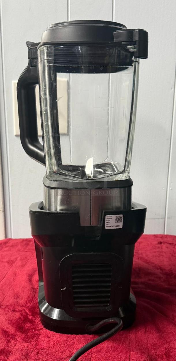 Ninja HB-152 blender, 1400 watts, 64 oz glass pitcher, black, nonstick, for hot/cold blending, shown on red cloth.