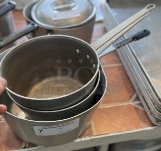 Assorted sauce pans, set of 3, metal construction, visible wear. Auction tag indicates lot number 7, quantity 3.