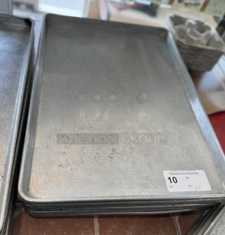 Large sheet pans, stack of 10, used condition with visible wear. Auction tag shows lot number 10 and bid X/10.