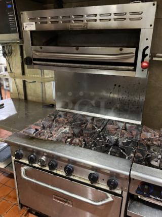 Tri Star 6 burner range with 36" salamander, stainless steel, tested and working, visible wear, model label on front.