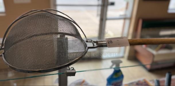 Double mesh strainer with wooden handle, metal frame, and tag labeled "28." Excellent condition, ideal for fine straining.