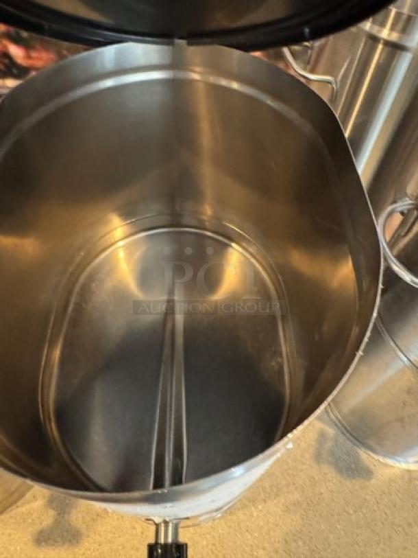 Stainless steel tea/beverage dispenser, open top view, shows clean interior; capacity for 2 beverages, with a spout.