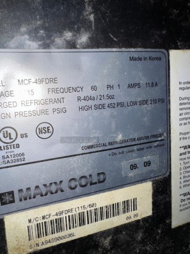 Maxxcold MCF-49DRE refrigerator label; specifies model, voltage, frequency, refrigerant type, and pressure ratings. Made in Korea.