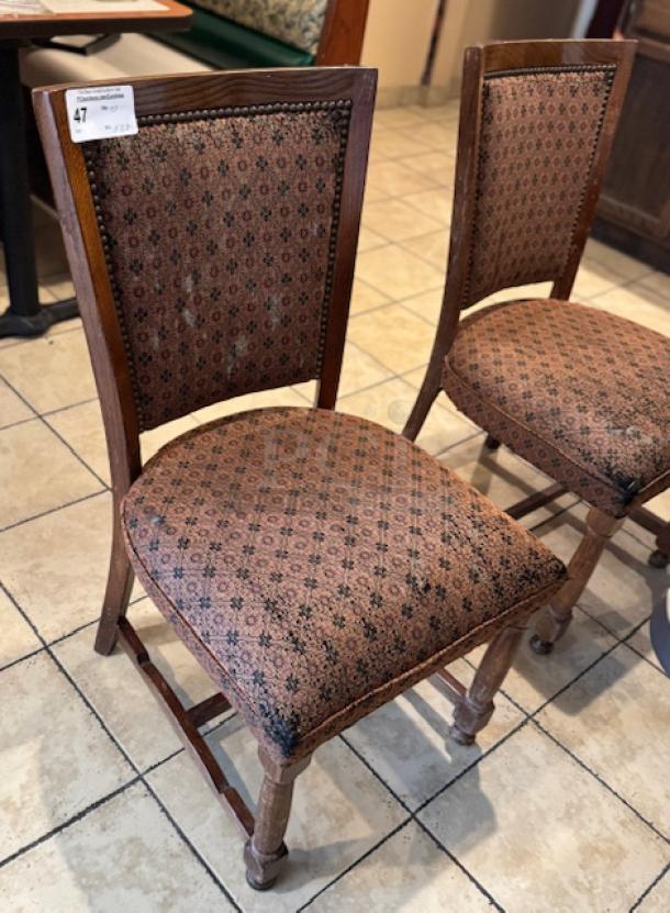 Set of 28 dining room chairs with patterned upholstery, wooden frames, and classic design. Some signs of wear.