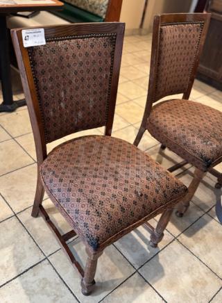 Set of 28 dining room chairs with patterned upholstery, wooden frames, and classic design. Some signs of wear.