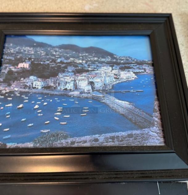 Framed Italian coastal artwork with boats, vibrant colors, in excellent condition, dimensions 6 inches, black frame.