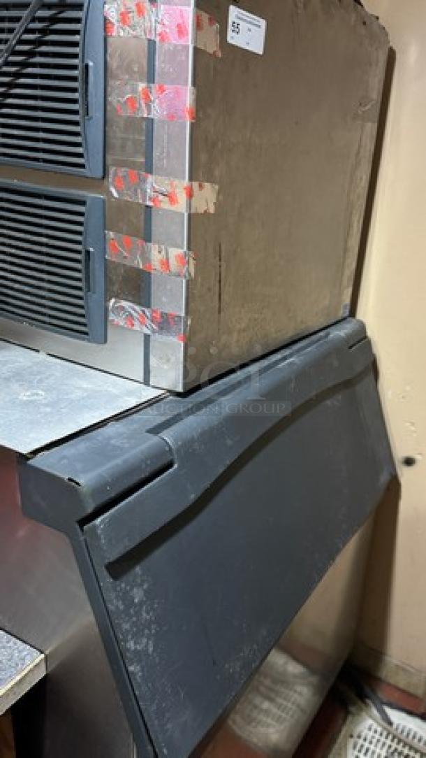 Prodigy ice maker, tested and working, black and silver design, visible wear with taped edges, auction tag number 55.