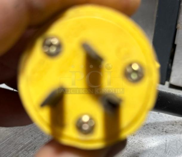 Prodigy Ice Maker plug, tested and working condition, yellow with three-prong configuration.