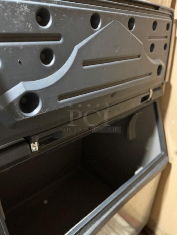 Prodigy ice maker, black, tested and working, open storage bin. Features durable construction, visible vents, and secure hinges.