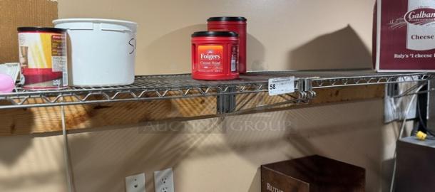 Wire wall shelving with multiple items placed on it, including a Folgers coffee container. Auction lot tag showing "58."