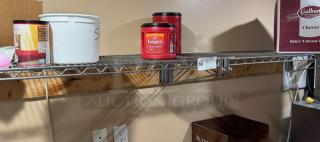 Wire wall shelving with multiple items placed on it, including a Folgers coffee container. Auction lot tag showing "58."