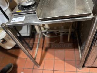 Stainless steel equipment stand with rectangular top, suitable for kitchen use. Visible label with lot number 61. Good condition.