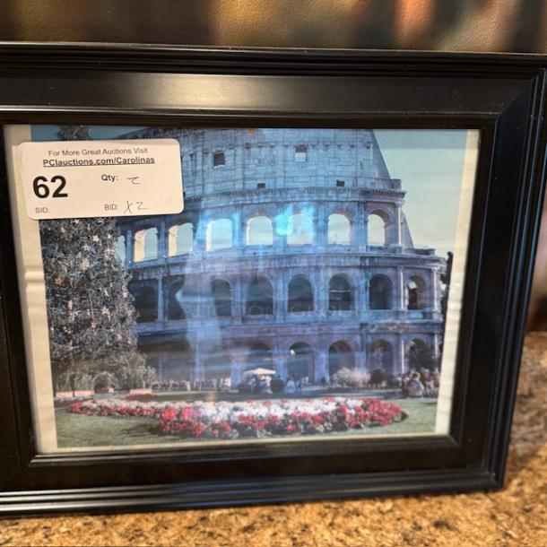 Framed Italian artwork depicting the Colosseum, auction lot 62, with bid and quantity tags visible on the front.