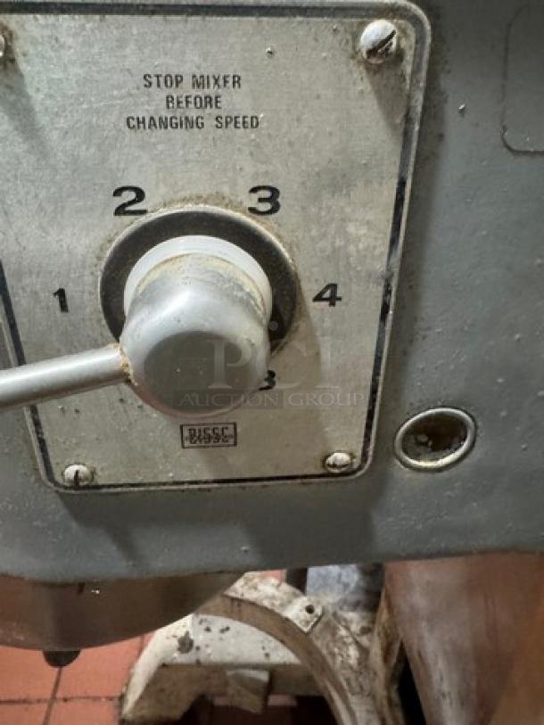 Hobart H600 60 Qt. Mixer, 3 Phase, features 4-speed settings, visible wear, includes "stop mixer before changing speed" label.