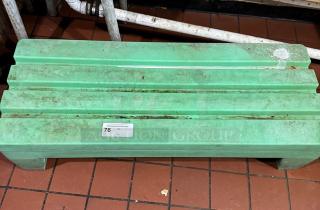 Green dunnage rack, used condition, showing label with number 76. Sturdy design for storage organization on tile floor.