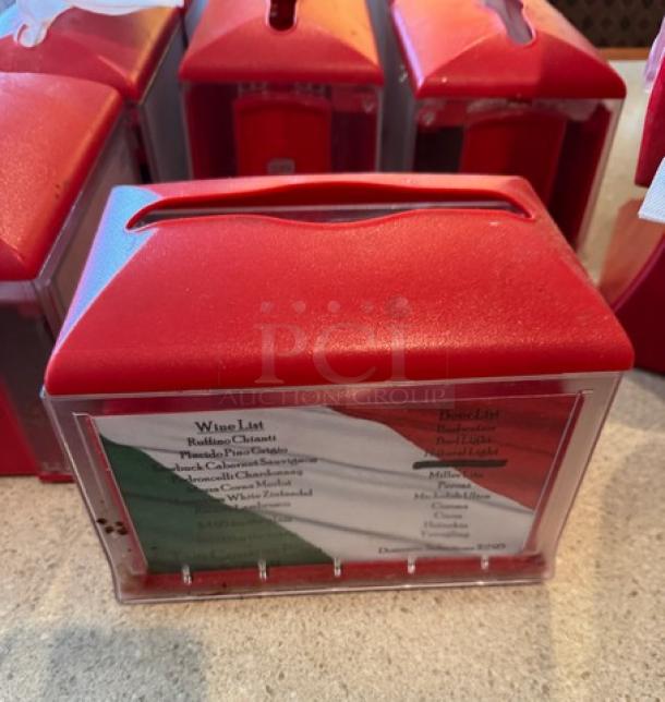 Red Xpressnap napkin holders, 17 pieces. Front displays menu insert. Some signs of use, suitable for high-traffic areas.