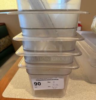 Stack of five clear plastic containers with three lids, used condition. Auction label indicates "Lot 90," includes partial lid quantity.