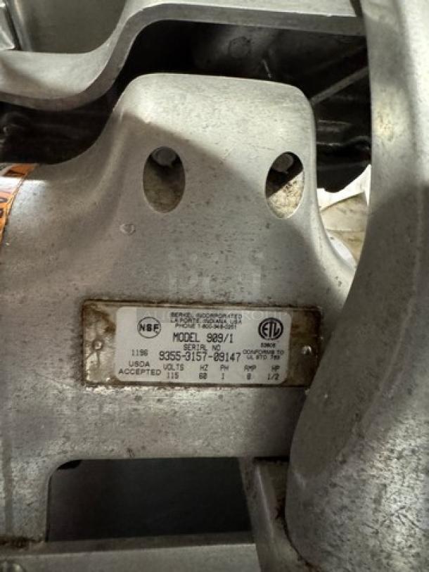 Berkel Meat Slicer Model 909/1, 115V. Features metal construction, tested and working. Label shows model and certifications.