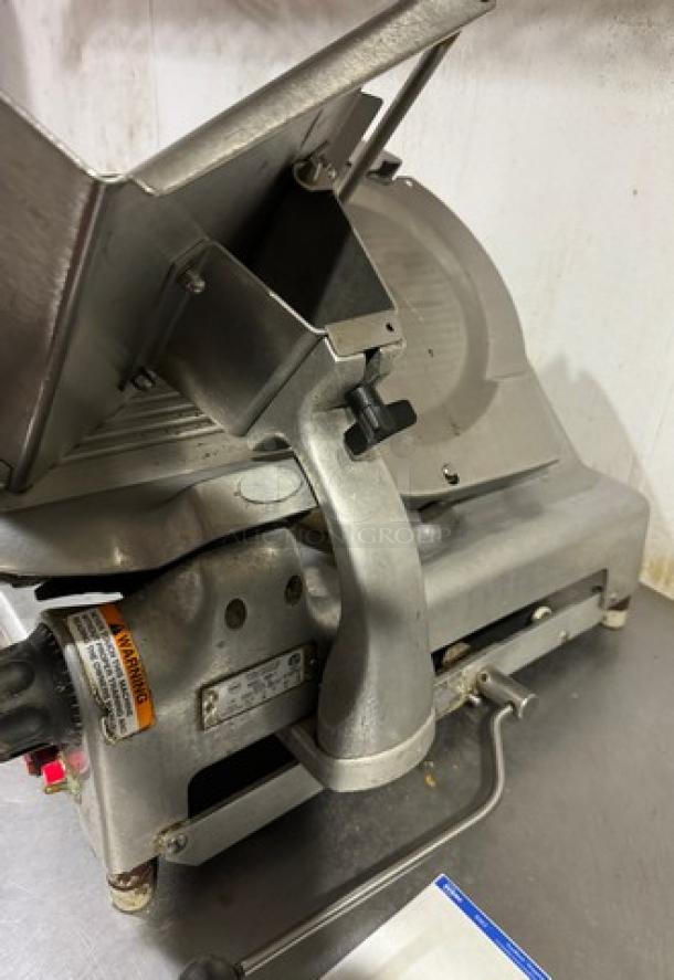 Berkel Meat Slicer, Model 909/1, 115 V, in tested working condition with visible controls and warning labels.
